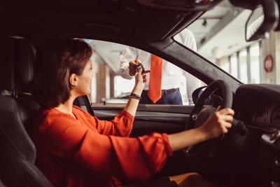 Women in car dealership key